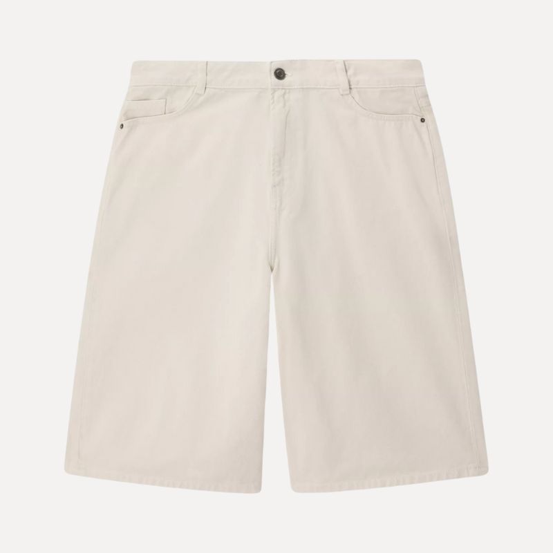 A cutout of cream bermuda denim shorts